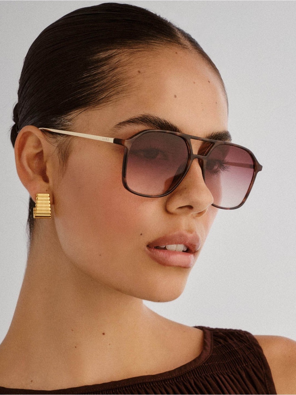 Aire Cusp Sunglasses in Dark Torte, Gold, and Dark Brown Gradient